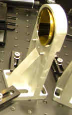 Figure 2: Diagram of mounting plate from Edmund Optics website (left) and custom-machined fixed mount (right)